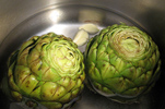 Artichokes Cooking with Garlic Cloves