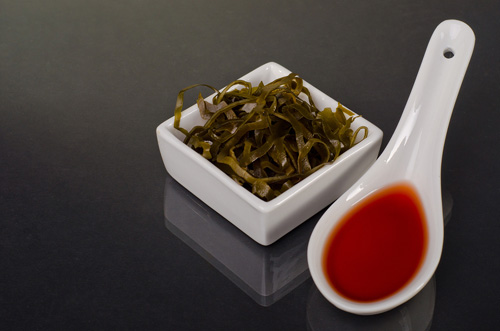 Edible Seaweed in White Ceramic Bowl With Sauce